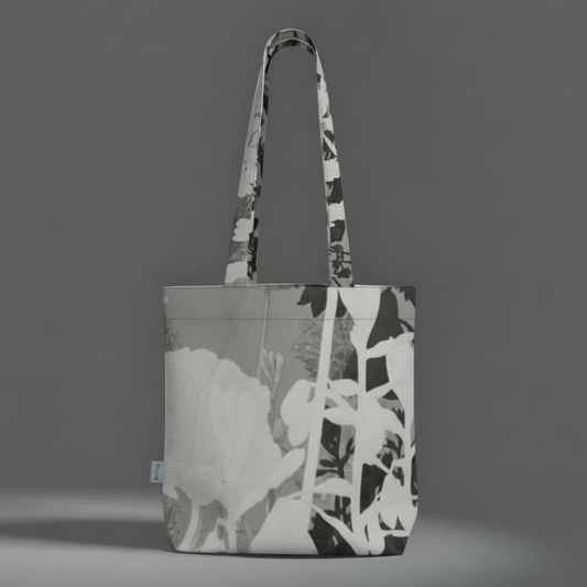 Tote bag with a black and white abstract design on a gray background