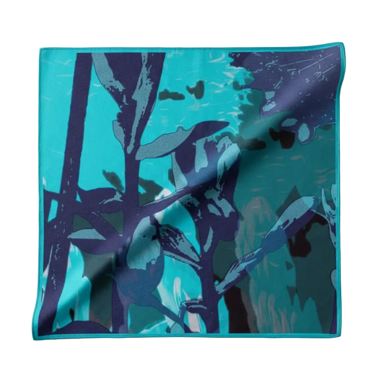 Teal fabric with purple tree pattern on a light gray background