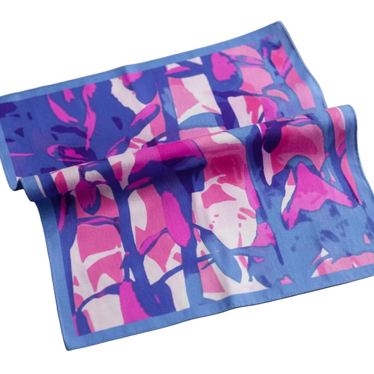 Colorful towel with abstract pattern on a wooden surface