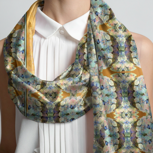 Mannequin wearing a white shirt with a colorful floral scarf draped over the shoulders.